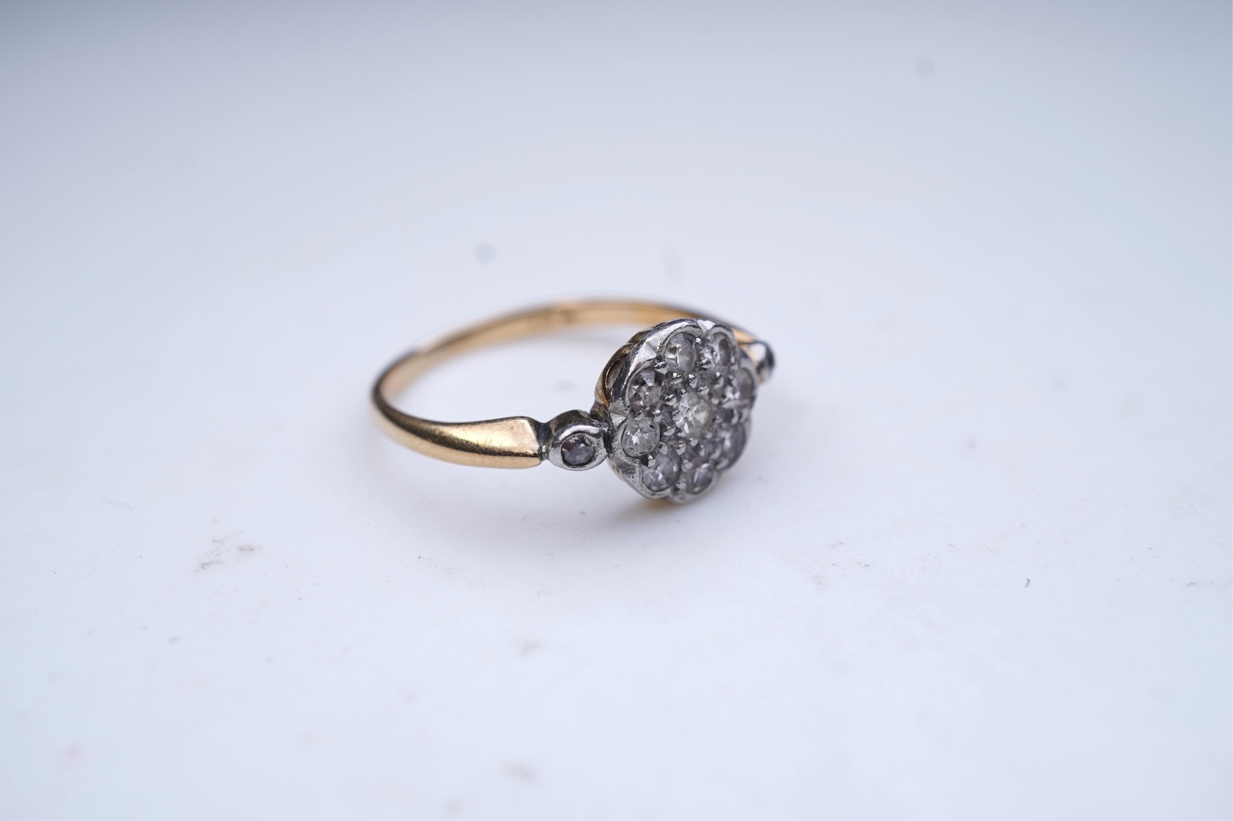 A diamond cluster ring, early 20th century